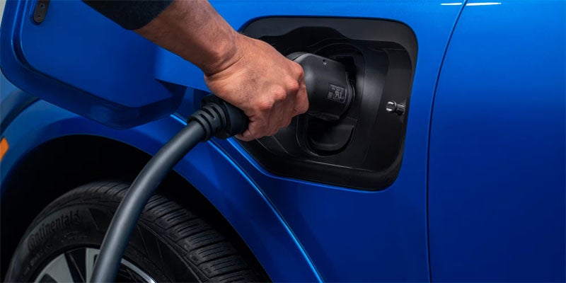 James Wood Motors Decatur in Decatur TX close up of a charging handle in a vehicle