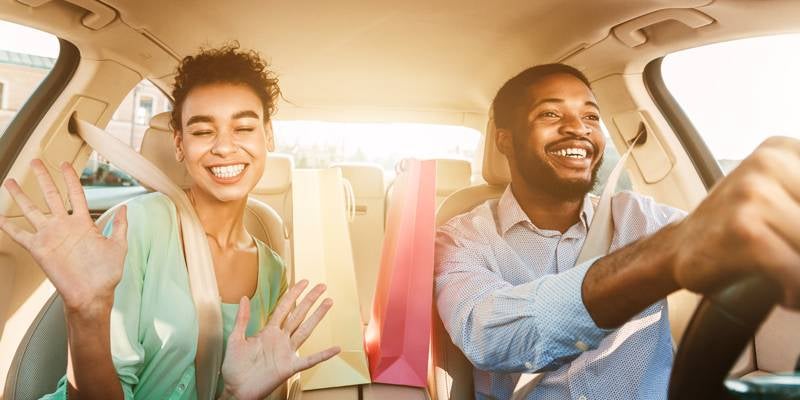James Wood Motors Decatur view of couple driving in their new car