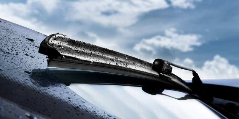 James Wood Motors Decatur in Decatur TX close up of windshield wipers with raindrops on them