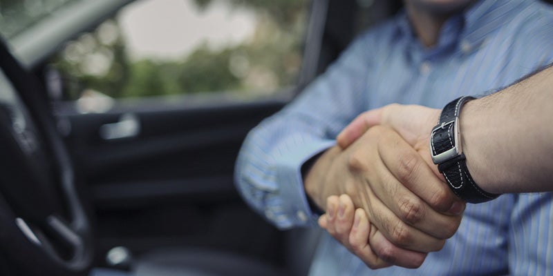 James Wood Motors Decatur in Decatur TX customer shaking hands with sales rep