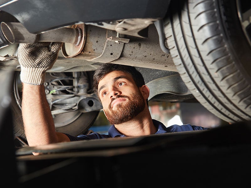 James Wood Motors Decatur in Decatur TX technician working on a vehicle